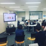Masashi Okuda anwering questions about his presentation